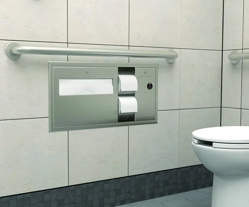 Photo of a grab bar and a toilet paper dispenser on the wall next to a toilet