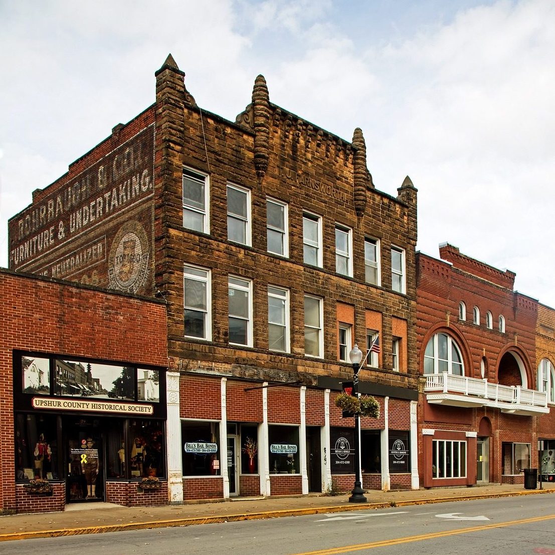 Mainstreet shopping in small towns can be an enjoyable activity. Buying bathroom stalls can be fun and easy too. Bathroom stalls for West Virginia organizations and businesses are available from Partition Plus. Photograph of quant, older buildings on a mainstreet, West Virginia.