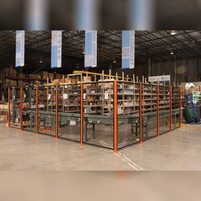 Photograph showing BeastWire mesh partition panels restricting access to hazardous industrial machinery.