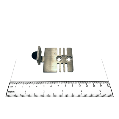 Photograph of the Bobrick Perpendicular Keeper - 1040-39 with a ruler.