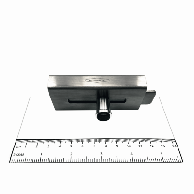 Photograph of the Bobrick Surface Latch Packet - 1040-42 with ruler for scale.