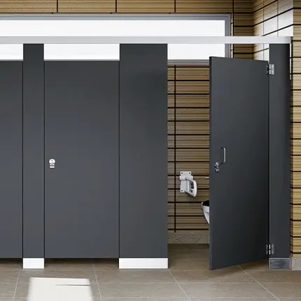 Photo of two black phenolic bathroom partition stalls
